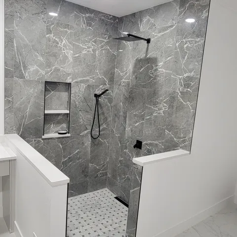 Double vanity with backlit mirror and marble-look floor