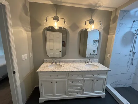 Vanity with marble top and double mirrors