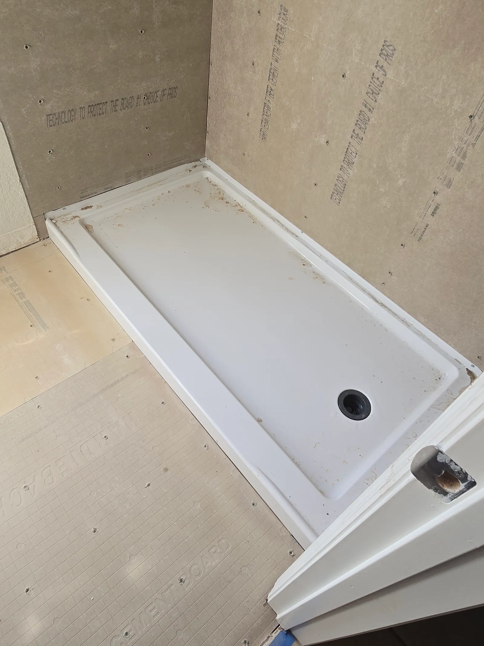 New shower pan set on the rebuilt subfloor