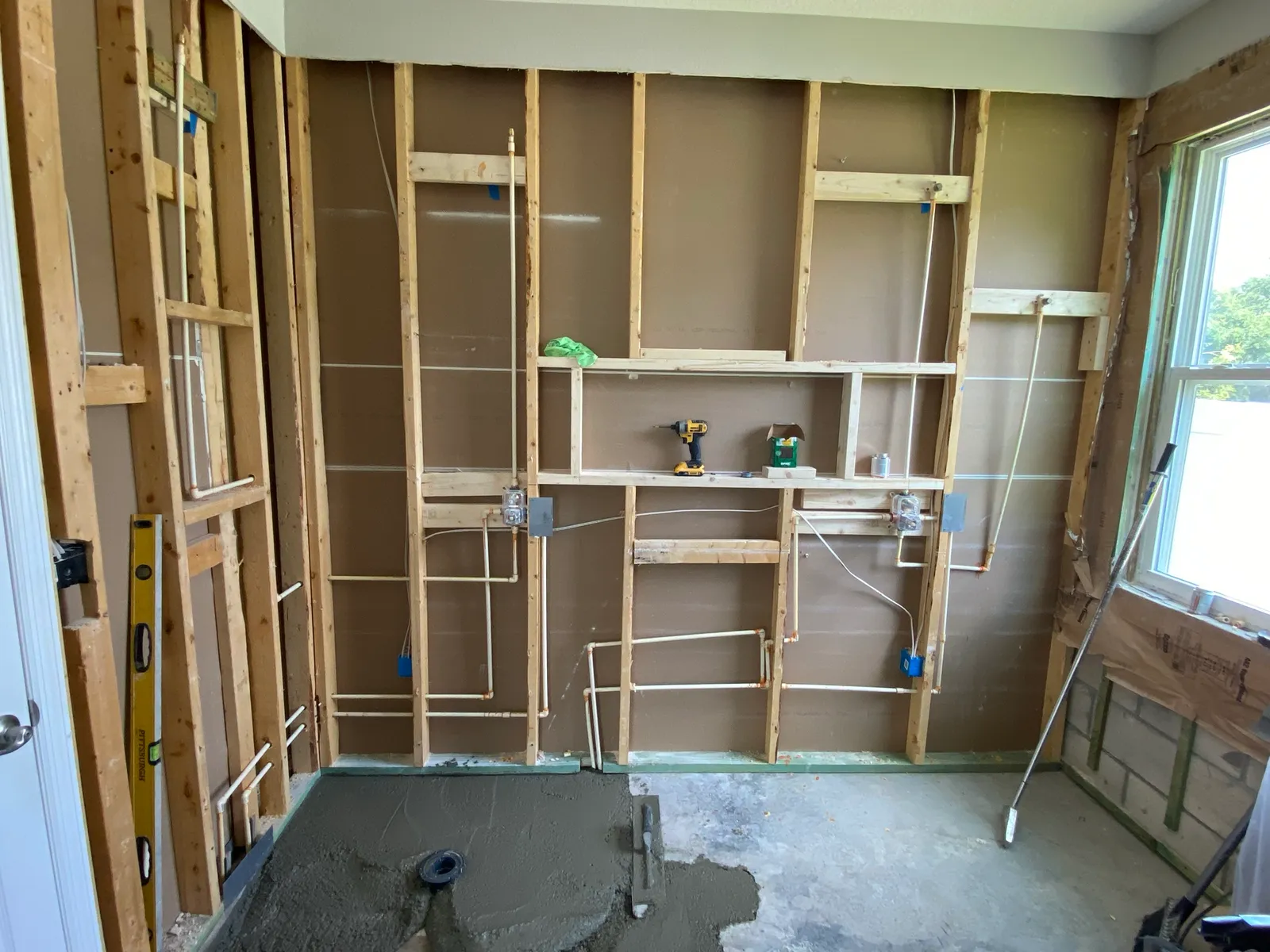 Bathroom demolished to the studs with new plumbing rough-in