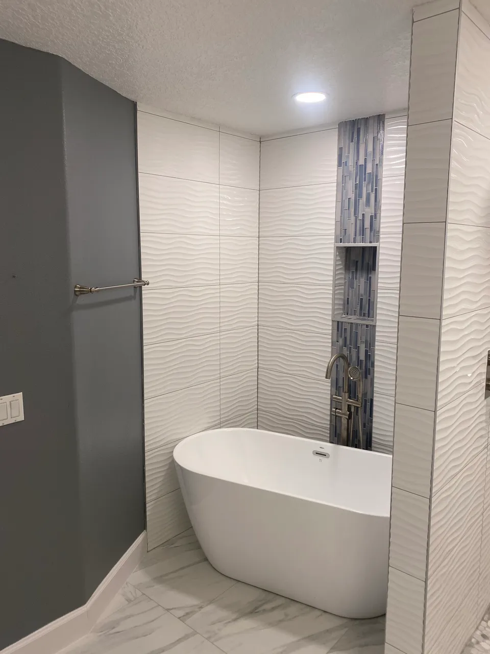 Finished vanities, tubs and fixtures by Contemporary Flooring & Bath